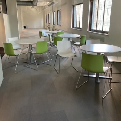 Green and white stacking chairs