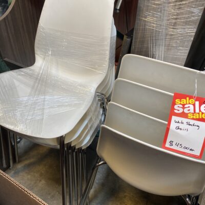 white stacking chairs with chrome base