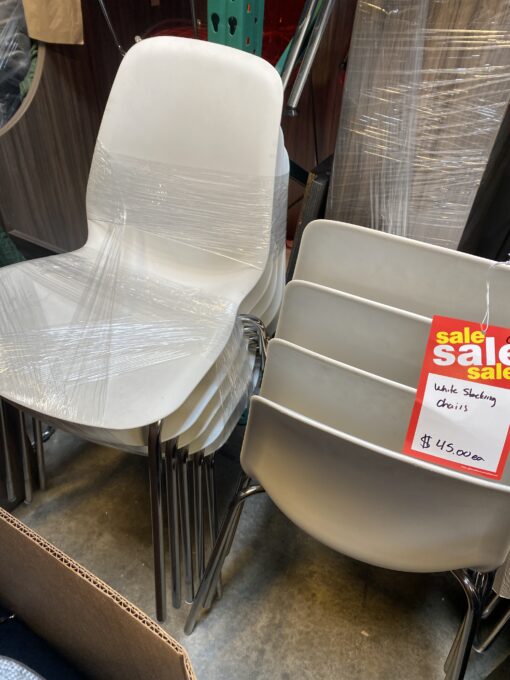 white stacking chairs with chrome base