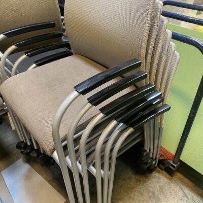 Tan stacking chairs on casters