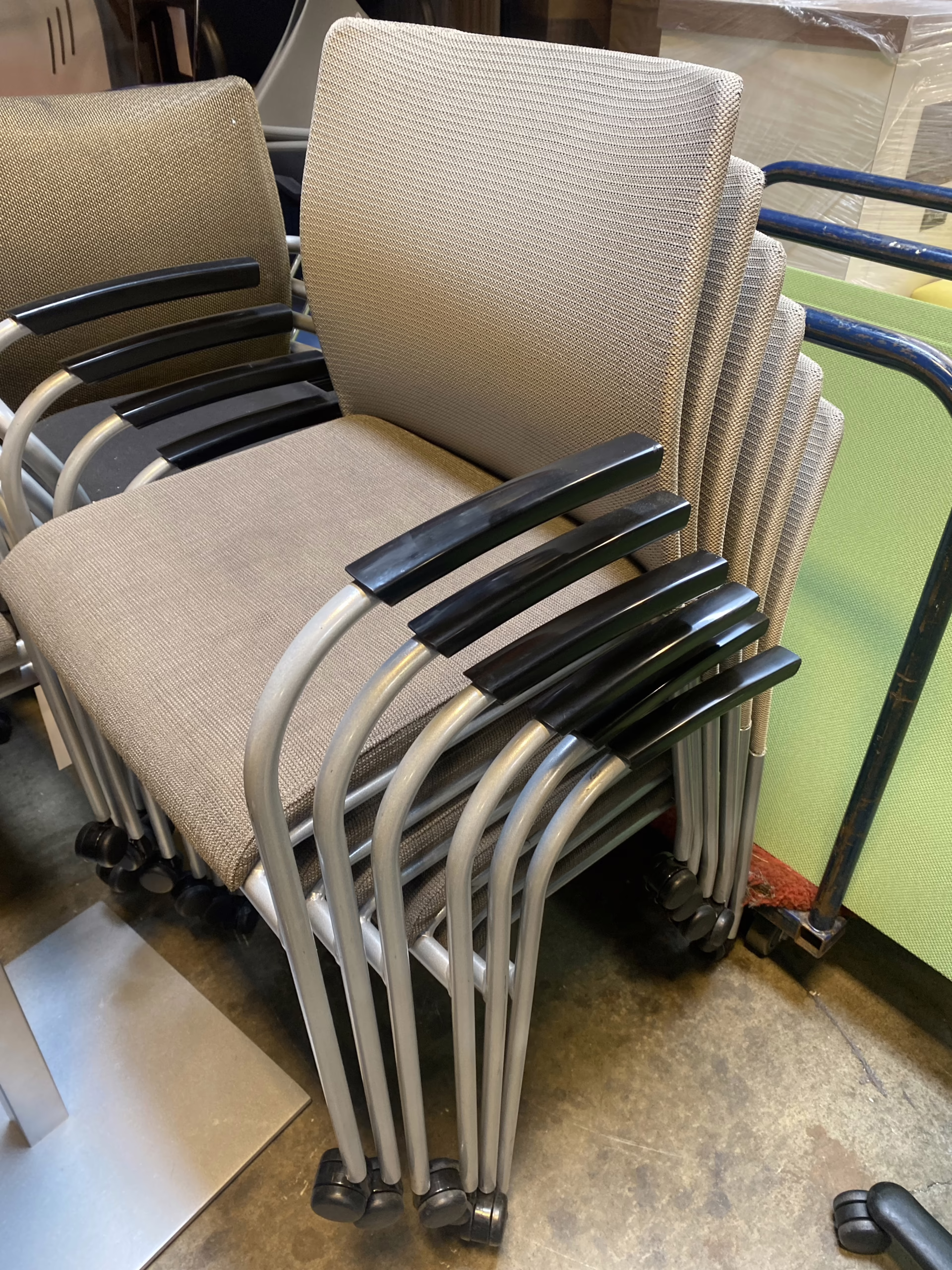Tan stacking chairs on casters